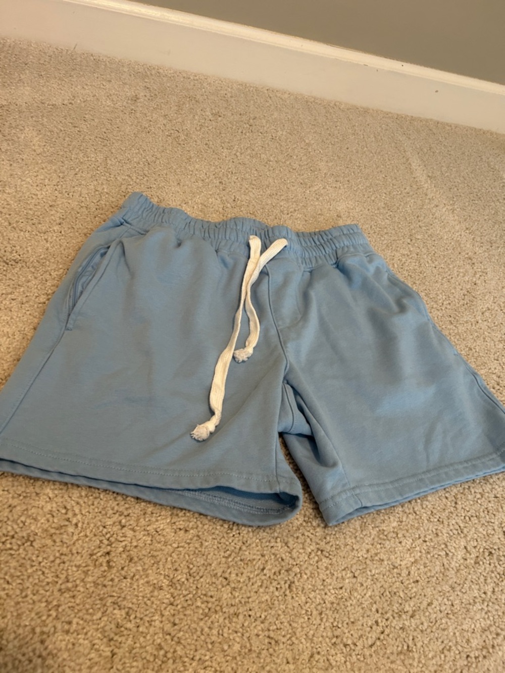 Men's Light Blue Athletic Drawstring Shorts with Pockets that have zippers